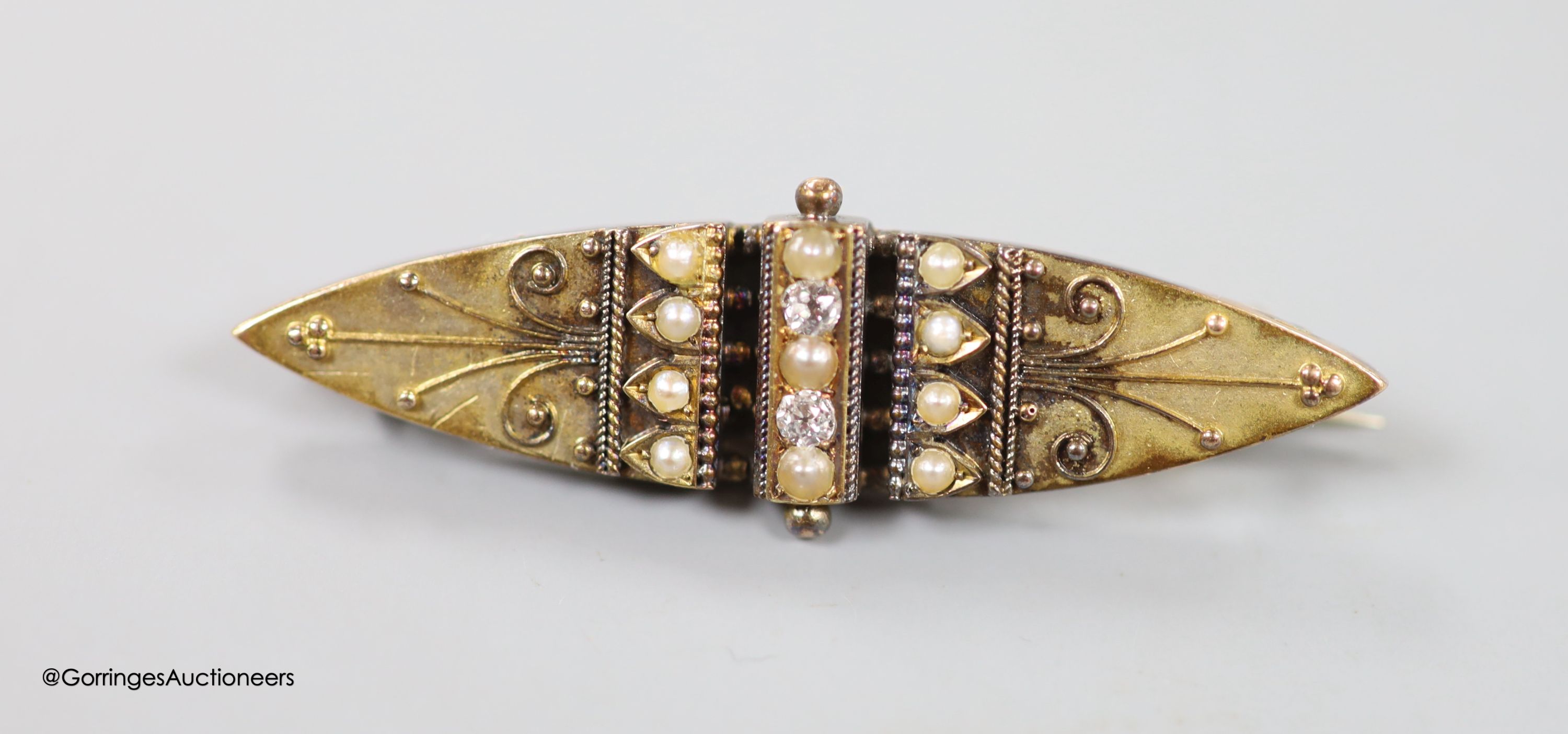 A 9ct three-colour gold puzzle ring, a Victorian yellow metal, 4.8 grams, rose diamond and onyx mourning brooch and four other items